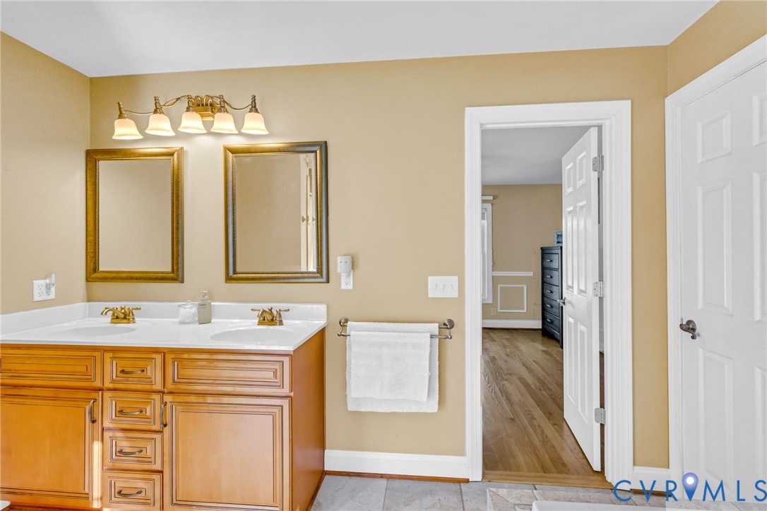 43 Ruddy Duck Road Heathsville, VA 22473 - Photo 26 of 46 a bathroom with a sink vanity and a mirror