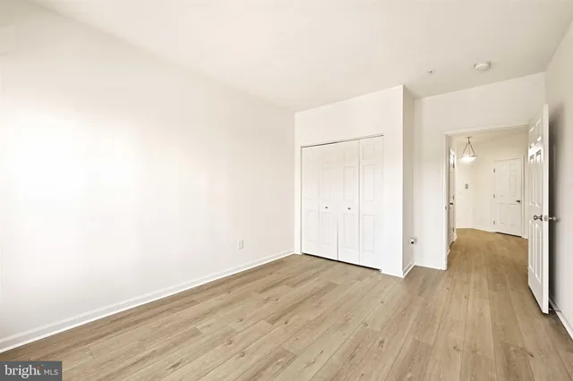 an empty room with wooden floor