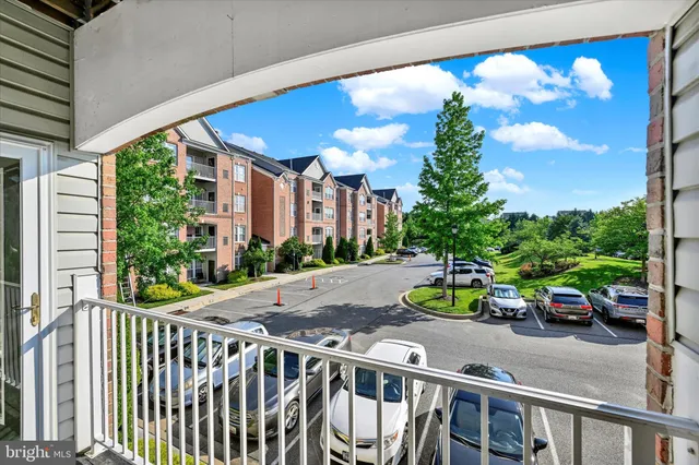 a view of a car park in front of a building