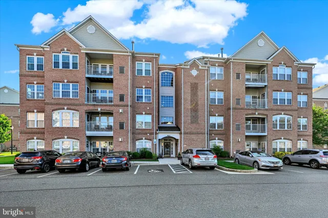 a view of a street that has couple of cars parked on the road
