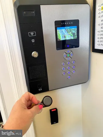 a bedroom with a bed and wall paintings