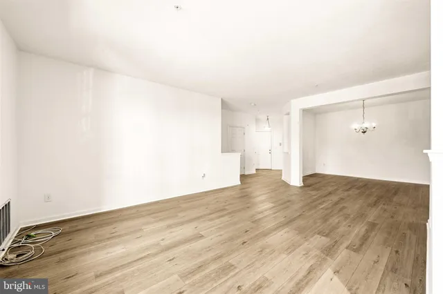 an empty room with wooden floor