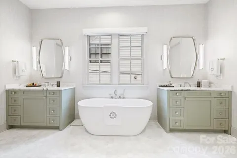 a bathroom with a shower and a glass door
