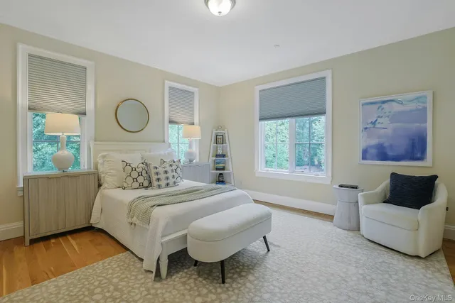 a spacious bedroom with a bed and a fireplace