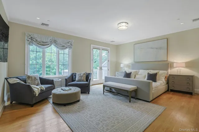 a balcony with wooden floor and fence