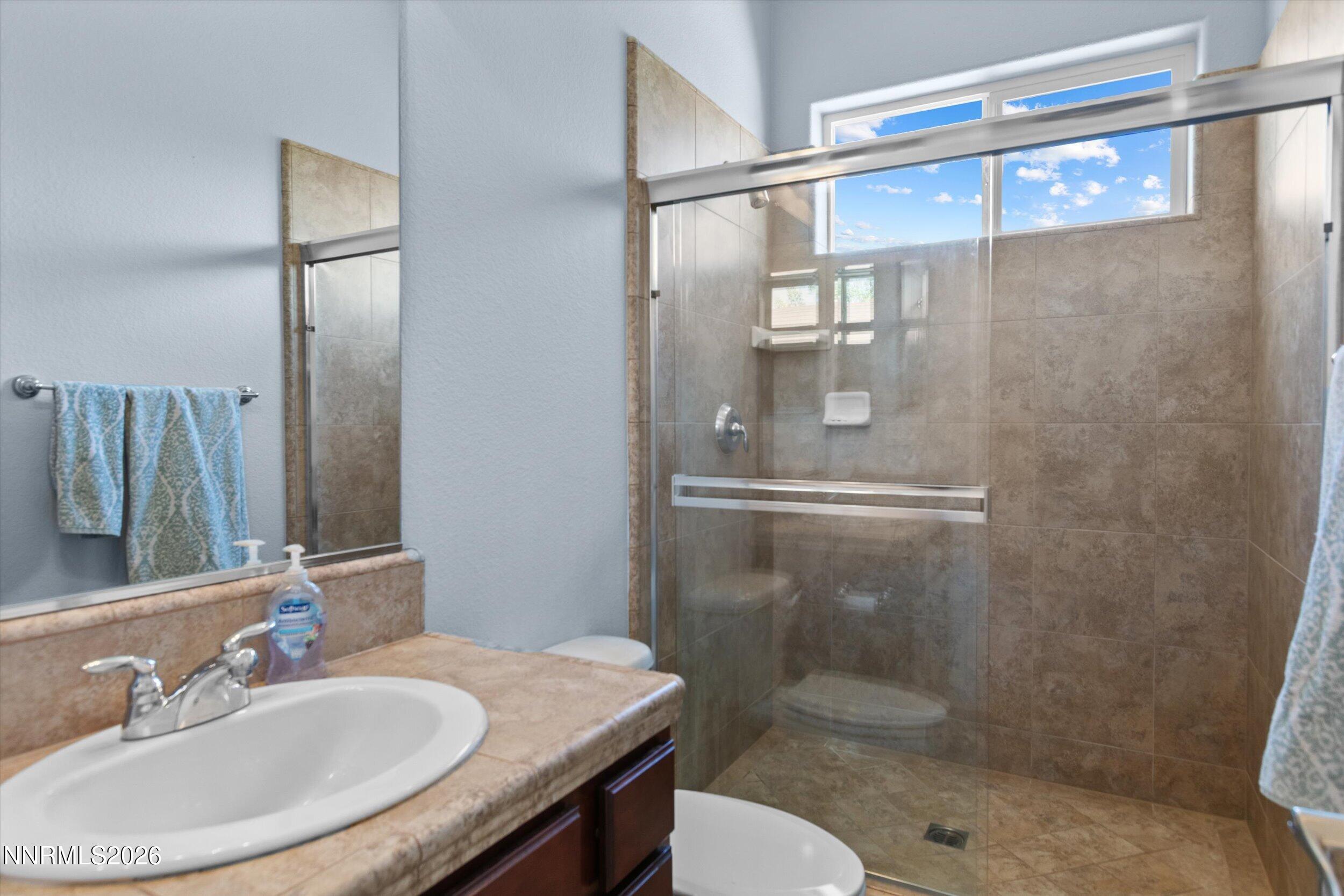 2920 Bull Rider Drive Reno, NV 89521 - Photo 23 of 51 a bathroom with a sink toilet and shower