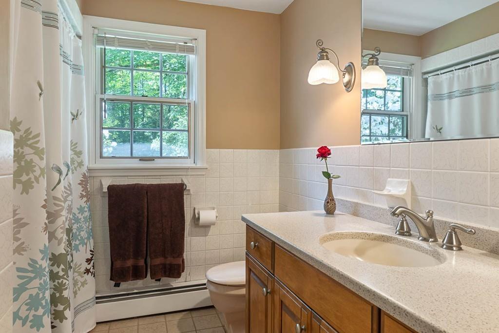 144 Worcester Road Princeton, MA 01541 - Photo 26 of 36 a bathroom with a granite countertop sink toilet and shower