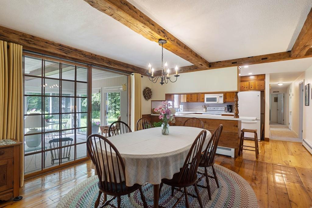 144 Worcester Road Princeton, MA 01541 - Photo 8 of 36 a dining room with furniture window and wooden floor