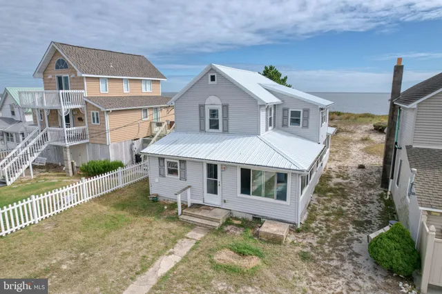 a aerial view of a house with a yard