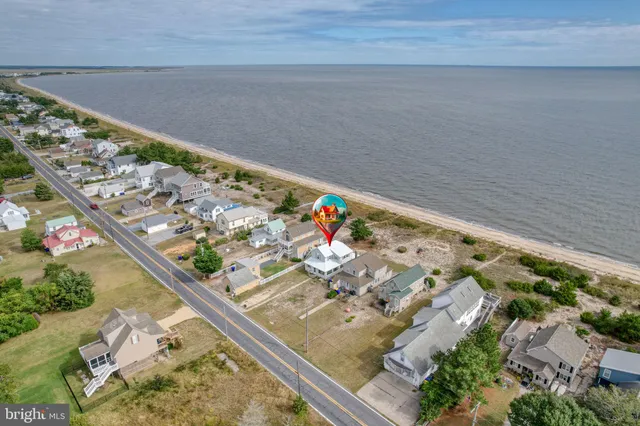 a view of a kitchen with a sink and cabinets