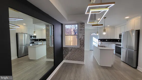 a kitchen with a refrigerator and a sink