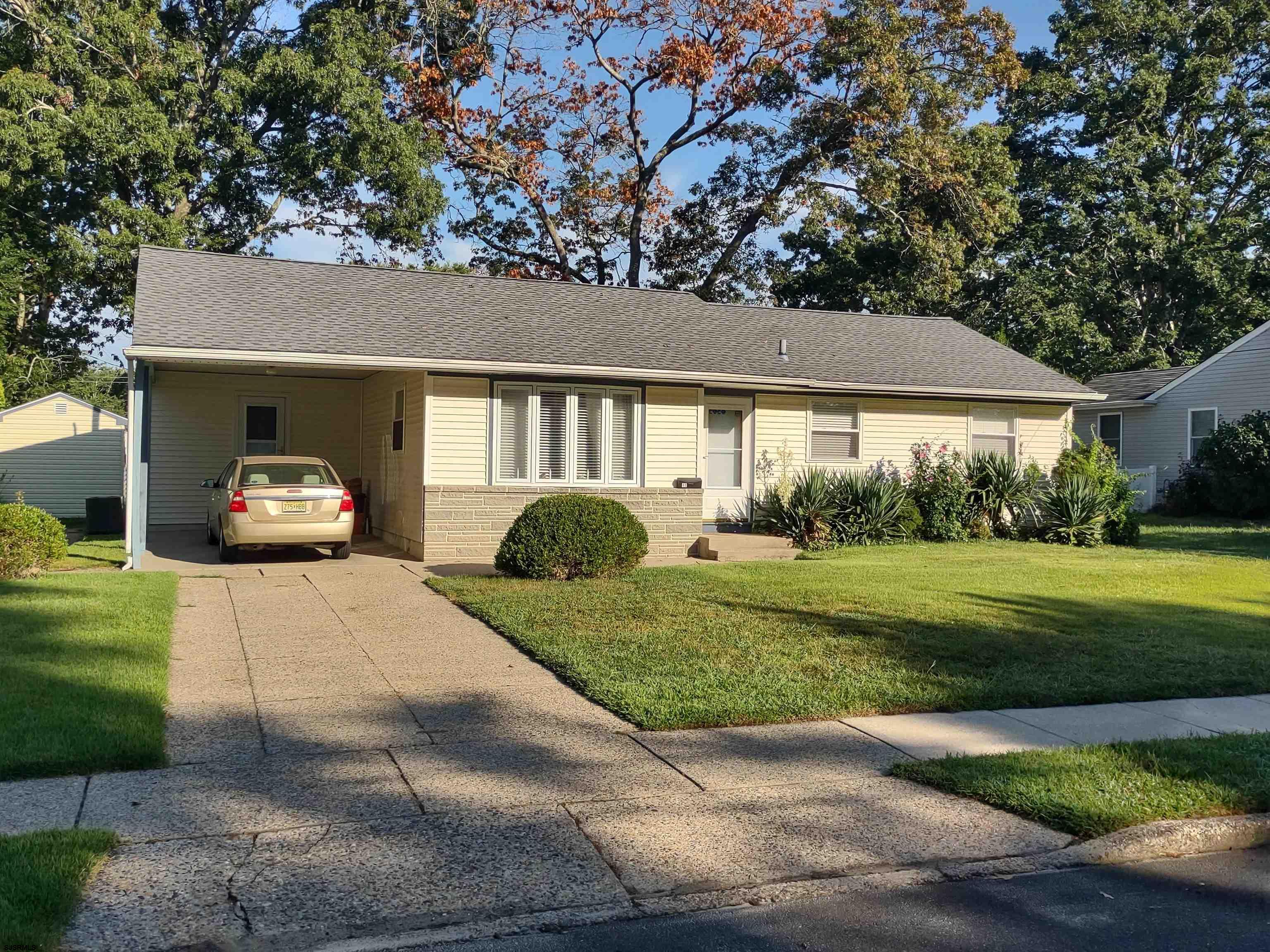12 Osborne Road Somers Point, NJ 08244 - Photo 1 of 15 a front view of a house with a yard