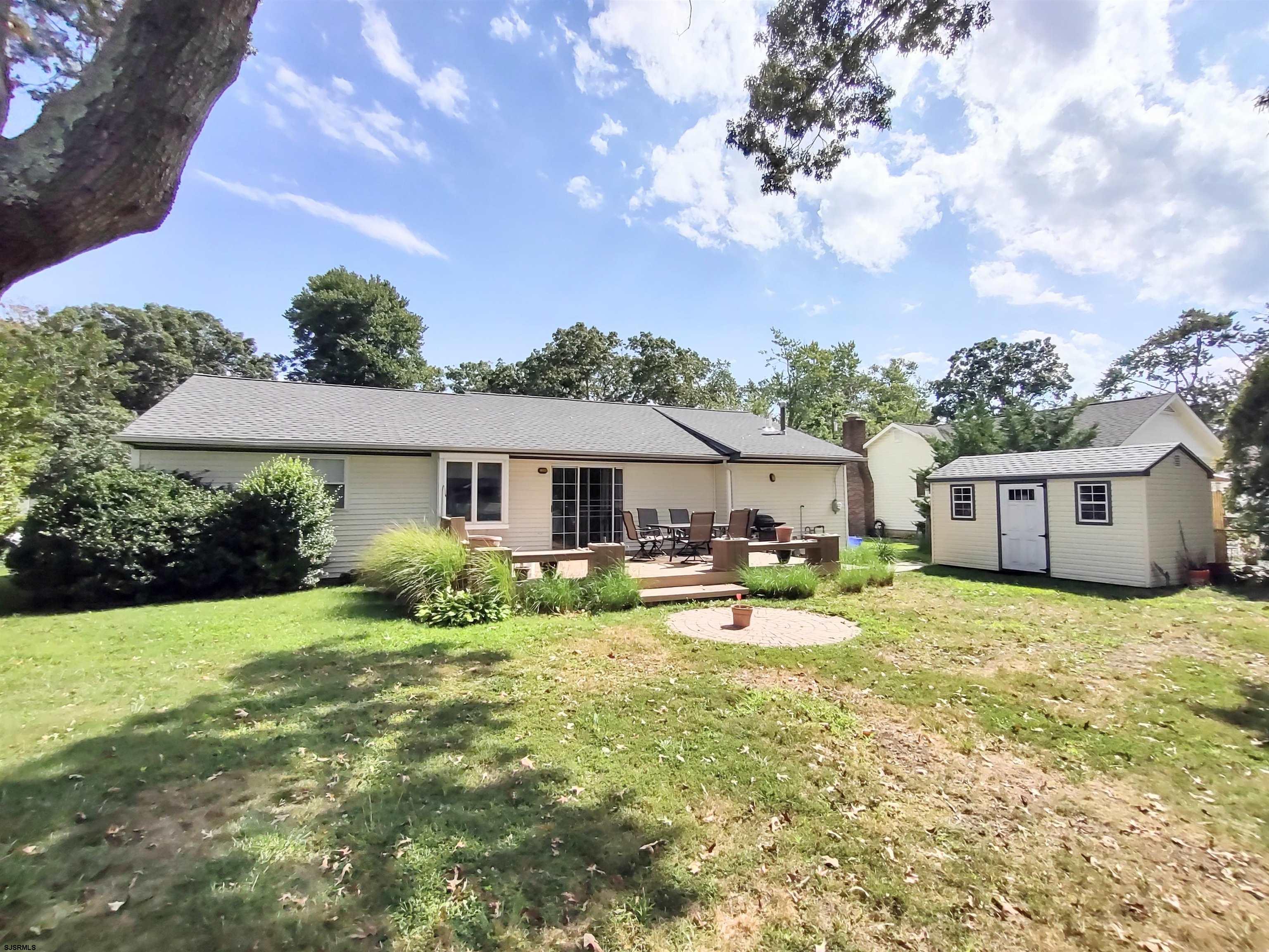 12 Osborne Road Somers Point, NJ 08244 - Photo 11 of 15 a view of a house with a big yard and sitting area