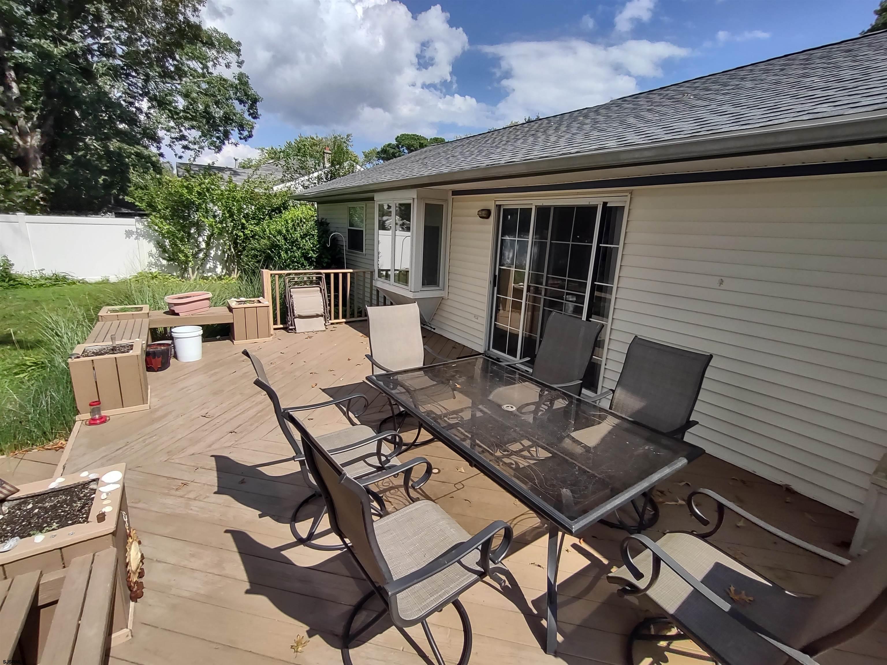 12 Osborne Road Somers Point, NJ 08244 - Photo 13 of 15 a view of backyard of a house with seating space