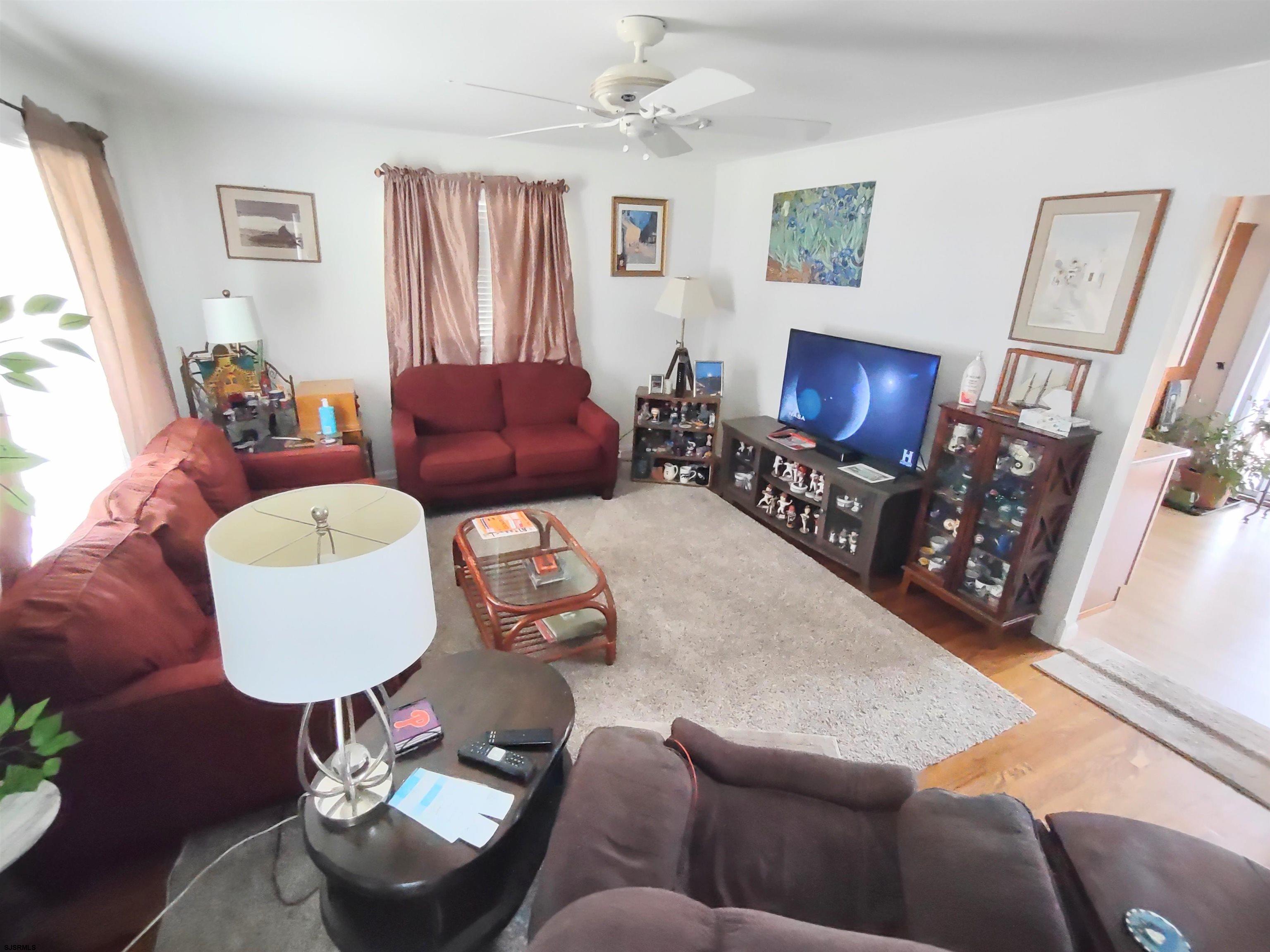 12 Osborne Road Somers Point, NJ 08244 - Photo 4 of 15 a living room with furniture and a flat screen tv