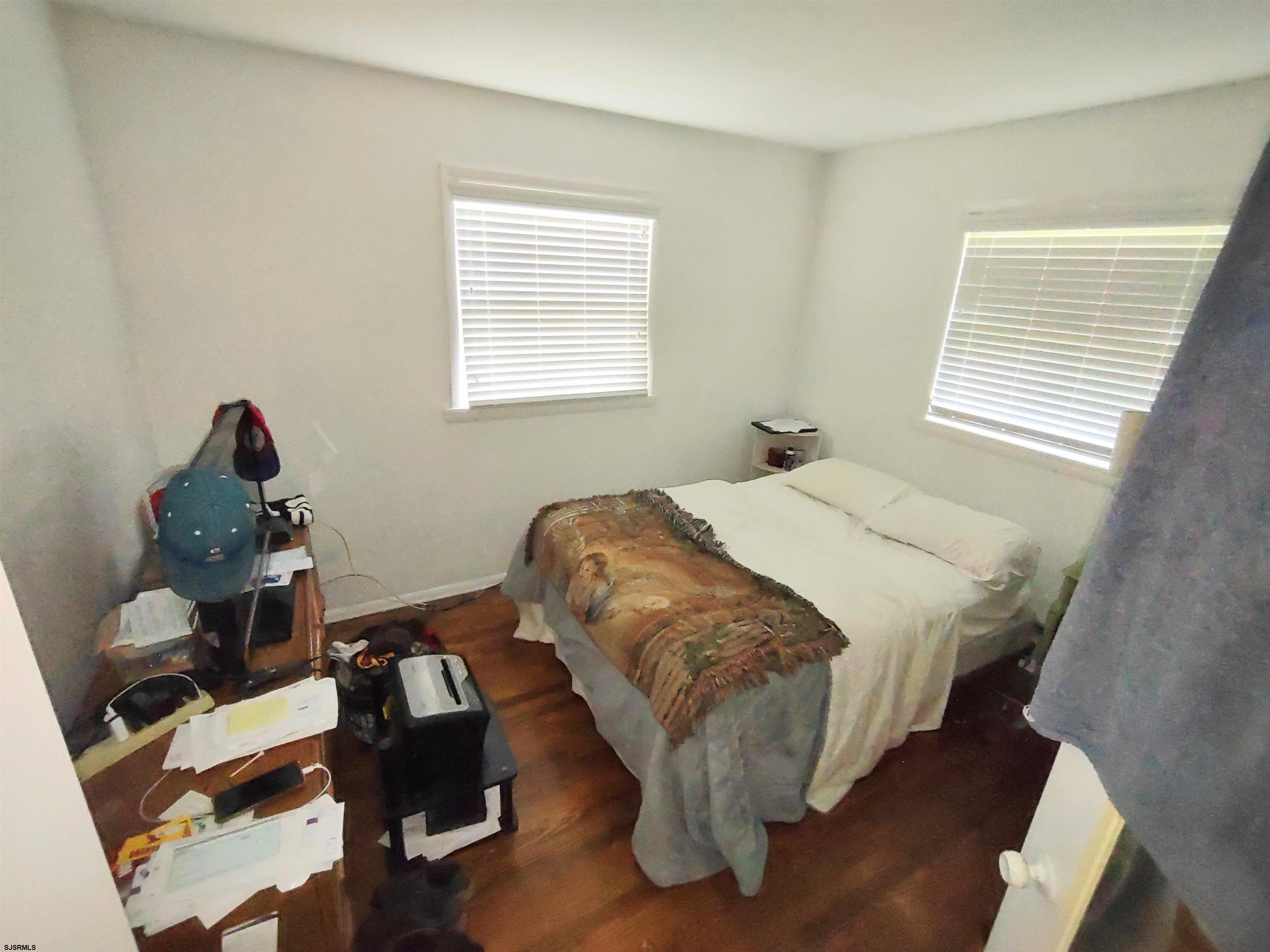 12 Osborne Road Somers Point, NJ 08244 - Photo 6 of 15 a bedroom with a bed and a window