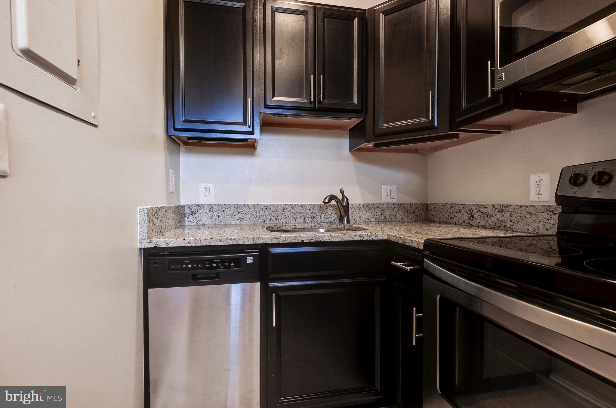 637 3rd Street Northeast, Unit 305 Washington, DC 20002 - Photo 5 of 16 Sleek kitchen with modern finishes.