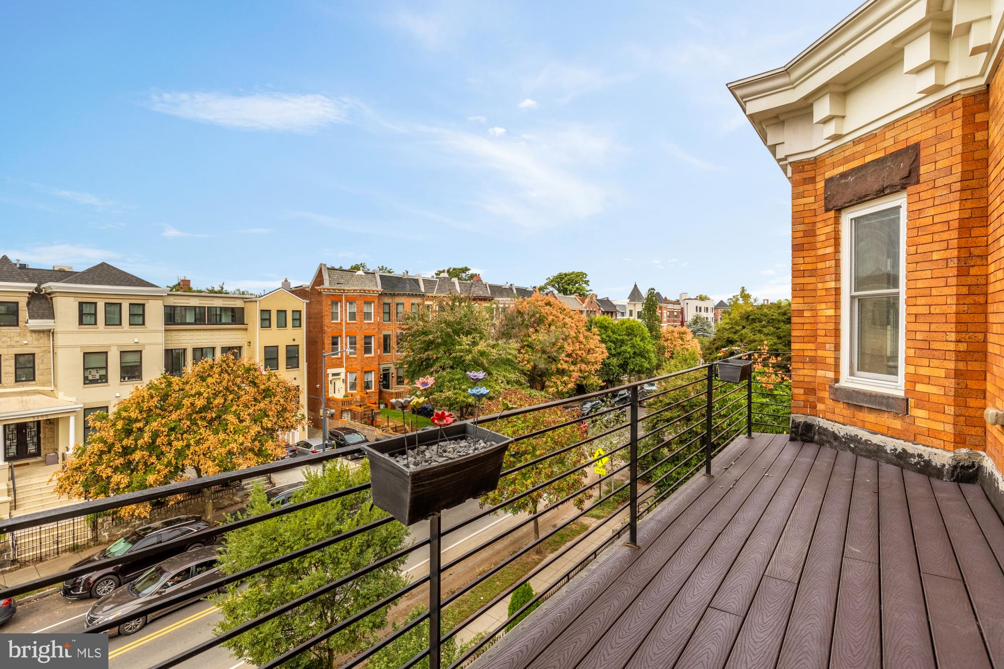 1249 Kenyon Street Northwest, Unit 4 Washington, DC 20010 - Photo 11 of 30 a view of a balcony with wooden floor and city view
