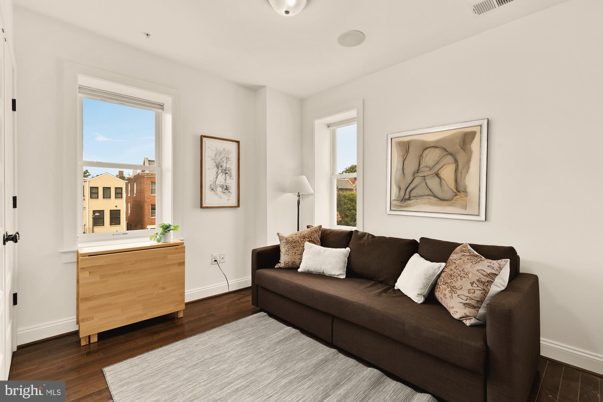 1249 Kenyon Street Northwest, Unit 4 Washington, DC 20010 - Photo 20 of 30 a living room with furniture and a window