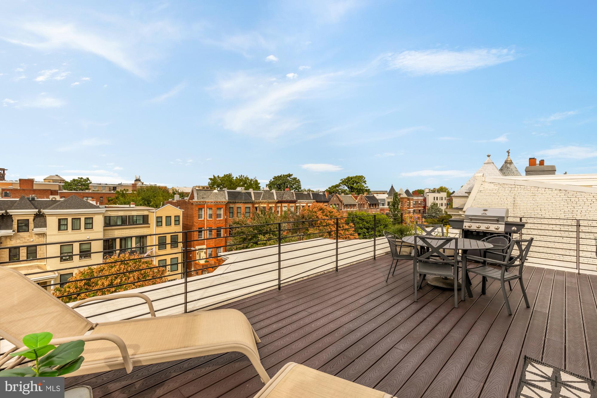 1249 Kenyon Street Northwest, Unit 4 Washington, DC 20010 - Photo 23 of 30 a view of a balcony with furniture and wooden floor