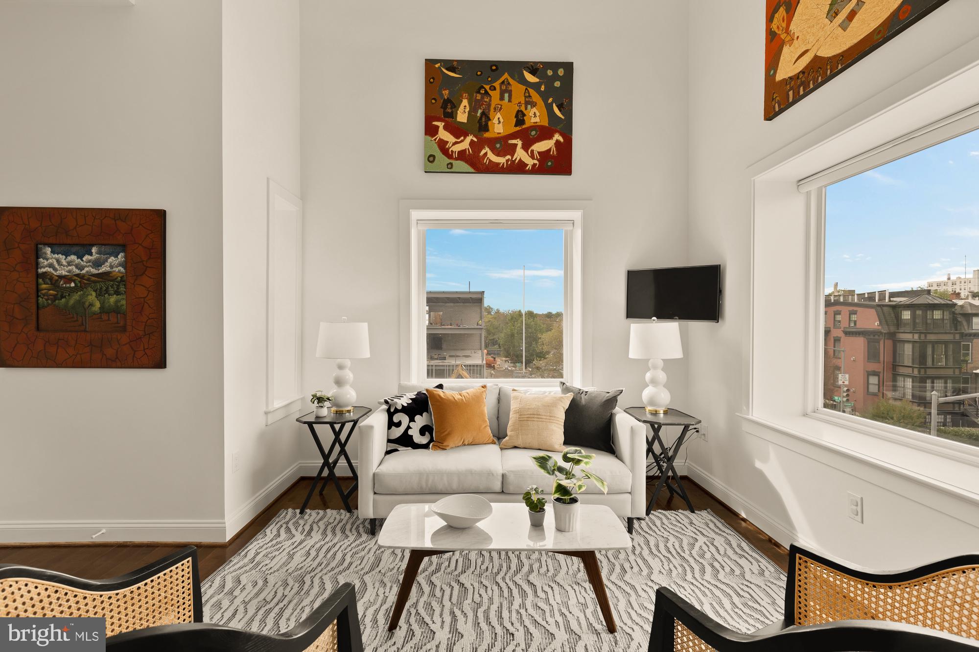 1249 Kenyon Street Northwest, Unit 4 Washington, DC 20010 - Photo 3 of 30 a living room with furniture and a large window