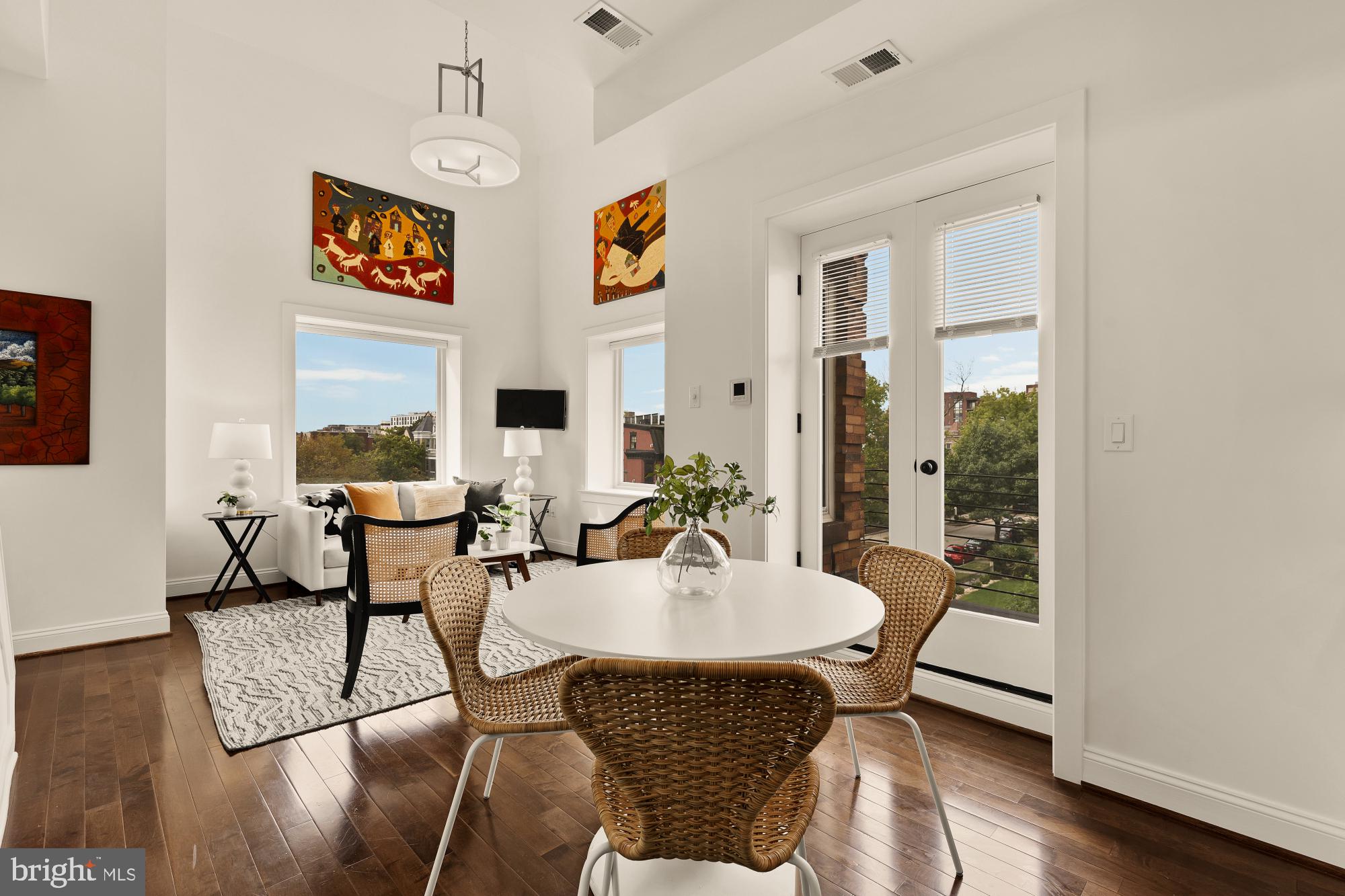 1249 Kenyon Street Northwest, Unit 4 Washington, DC 20010 - Photo 6 of 30 a dining room with furniture and wooden floor