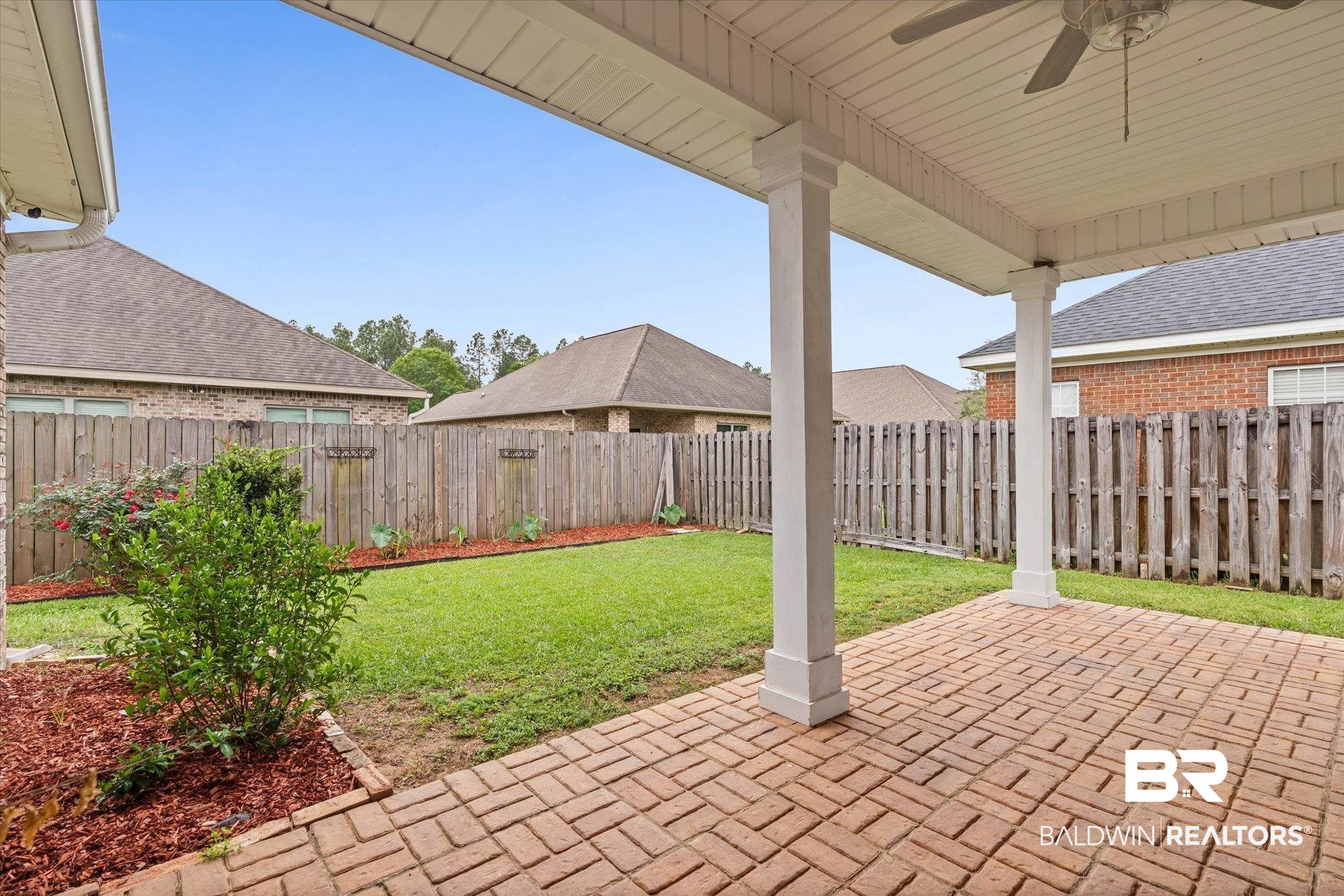 1003 Weatherby Street South Saraland, AL 36571 - Photo 29 of 31 Fenced backyard featuring a patio area and a ceiling fan