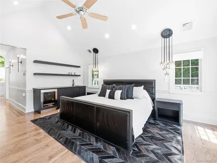 a bedroom with a bed and a fireplace
