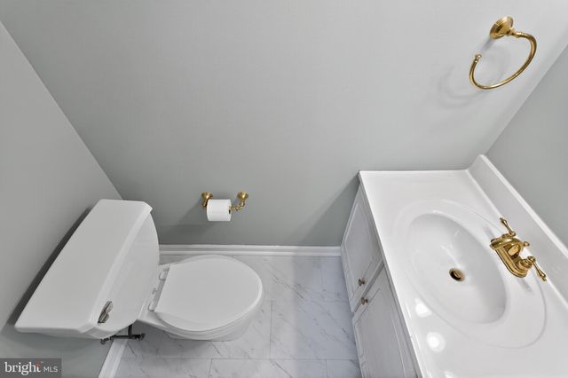 a bathroom with a sink and toilet