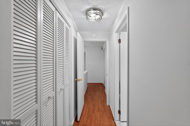 a view of a hallway with a door