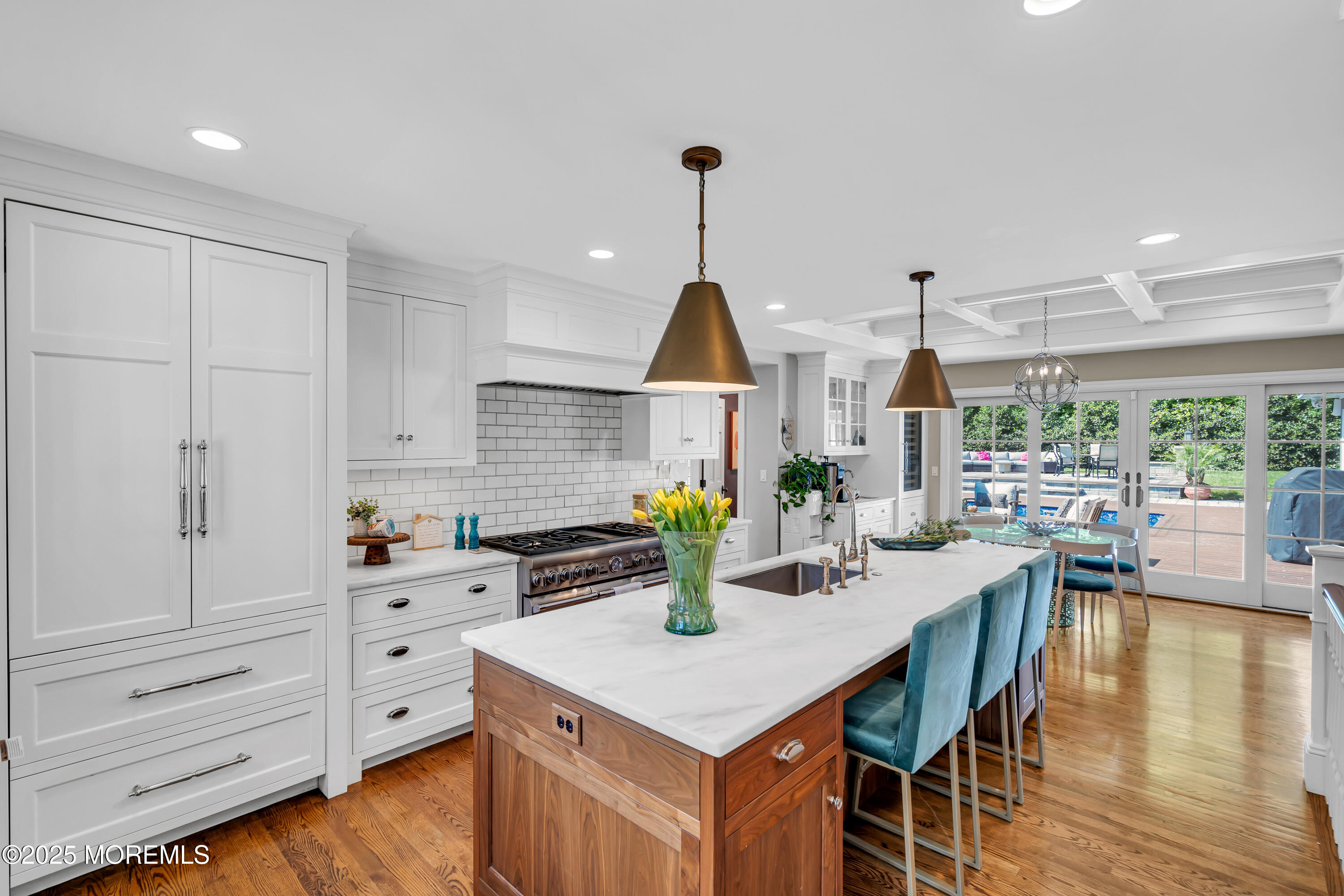 91 Ridge Road Rumson, NJ 07760 - Photo 21 of 80 a kitchen with stainless steel appliances kitchen island granite countertop a table chairs and a view of living room