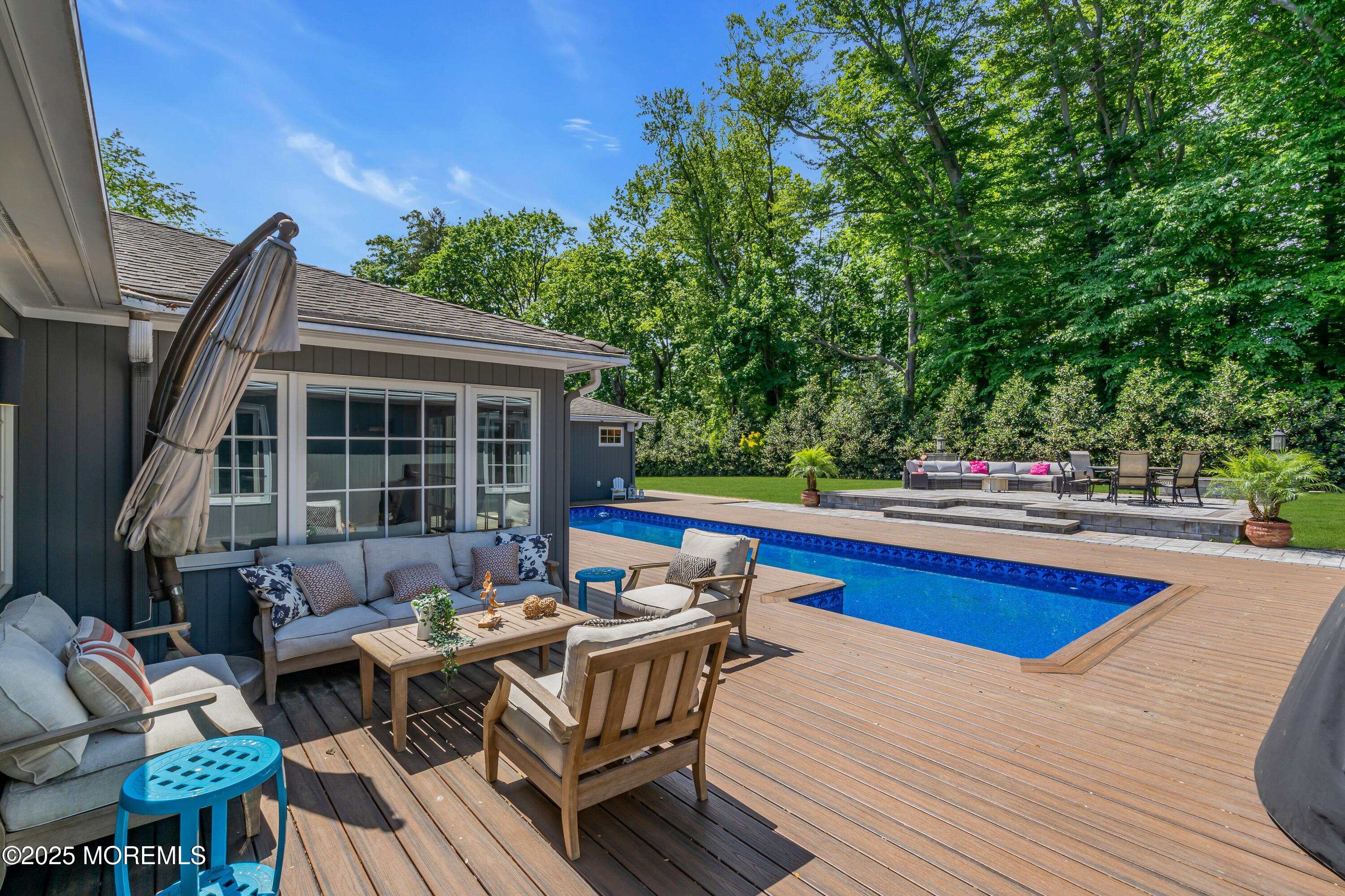 91 Ridge Road Rumson, NJ 07760 - Photo 24 of 80 a roof deck with table and chairs and potted plants with wooden floor and fence