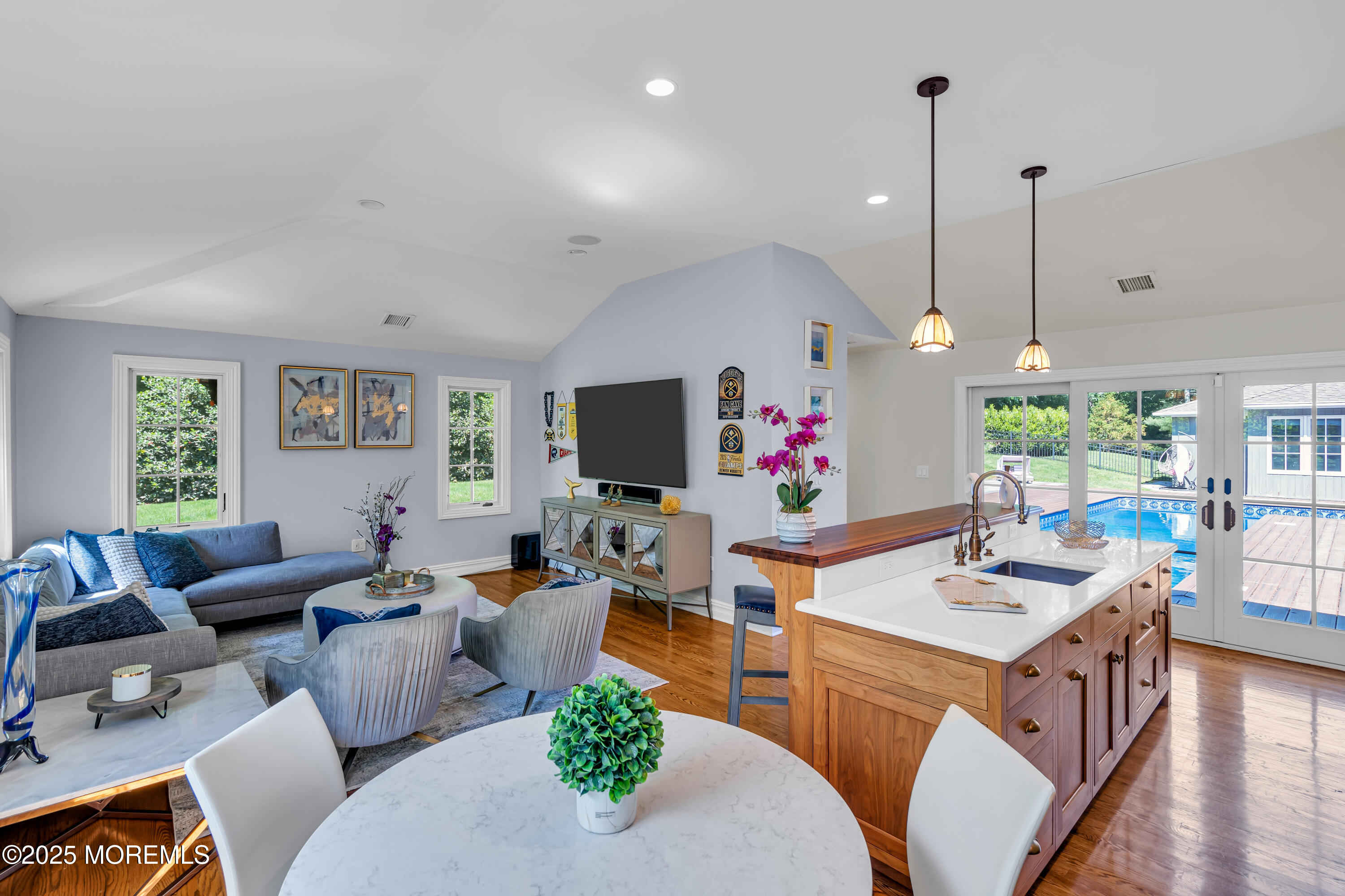 91 Ridge Road Rumson, NJ 07760 - Photo 33 of 80 a living room with furniture kitchen view and a flat screen tv