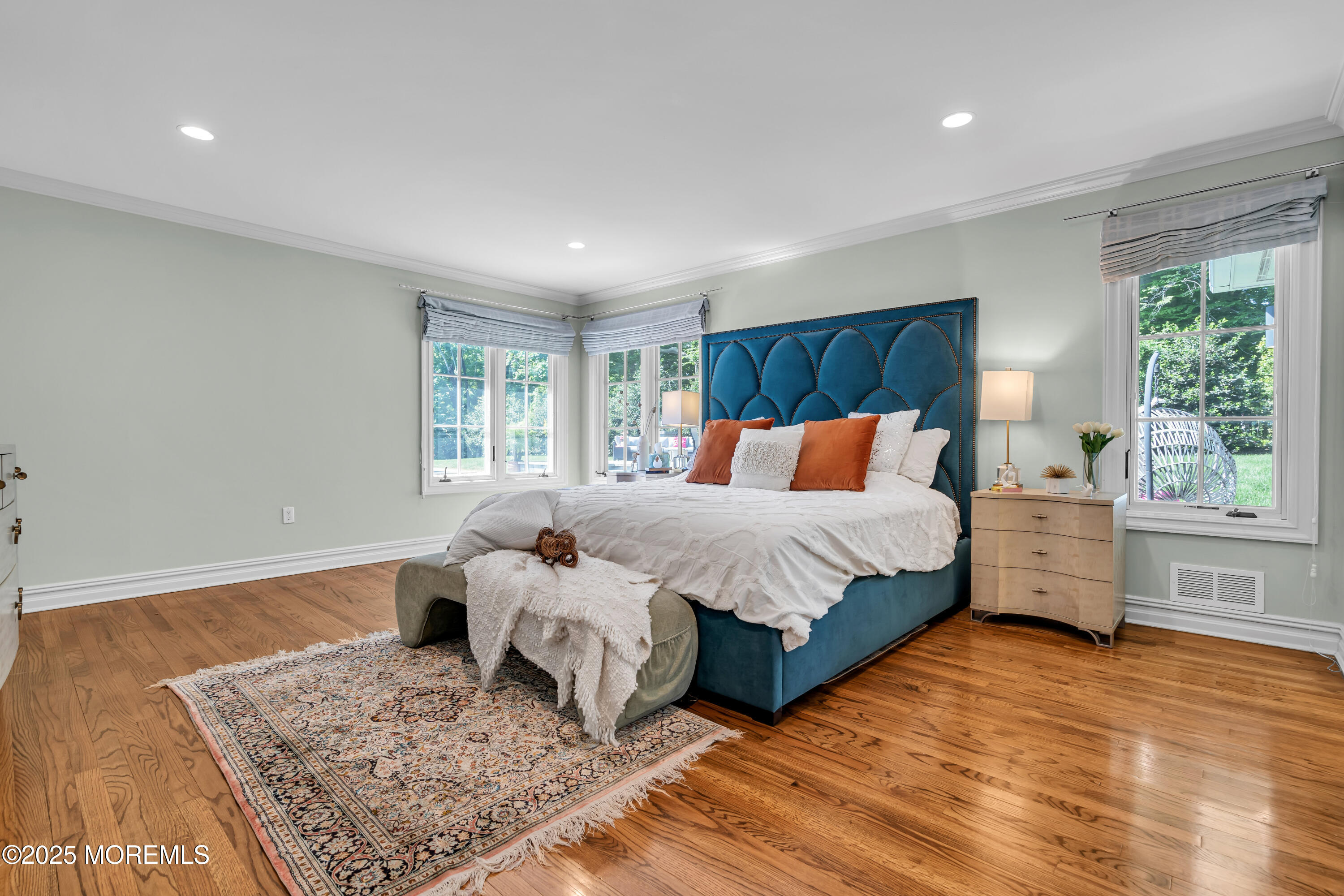 91 Ridge Road Rumson, NJ 07760 - Photo 36 of 80 a bedroom with a large bed and wooden floor