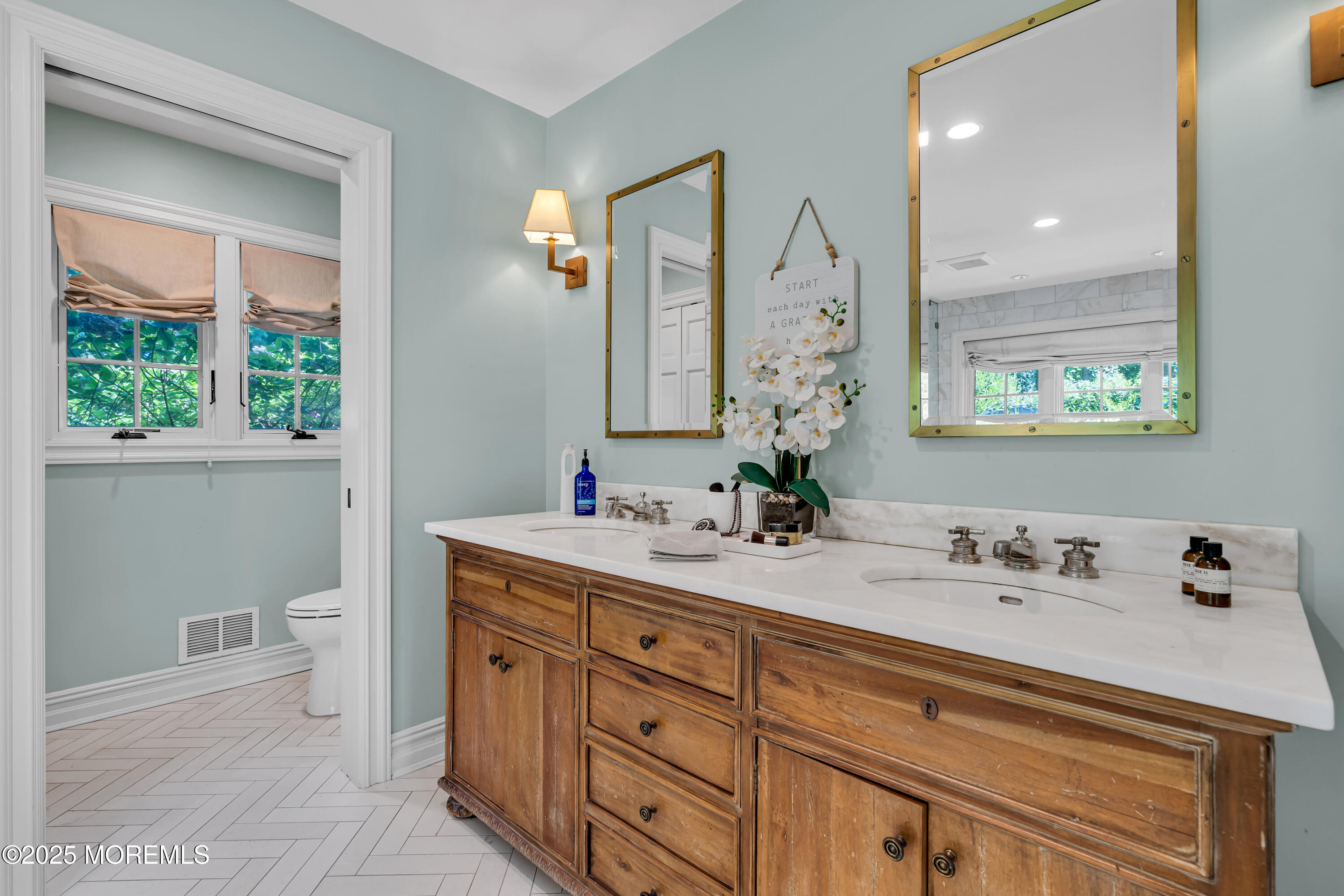 91 Ridge Road Rumson, NJ 07760 - Photo 40 of 80 a bathroom with a granite countertop sink mirror and a toilet