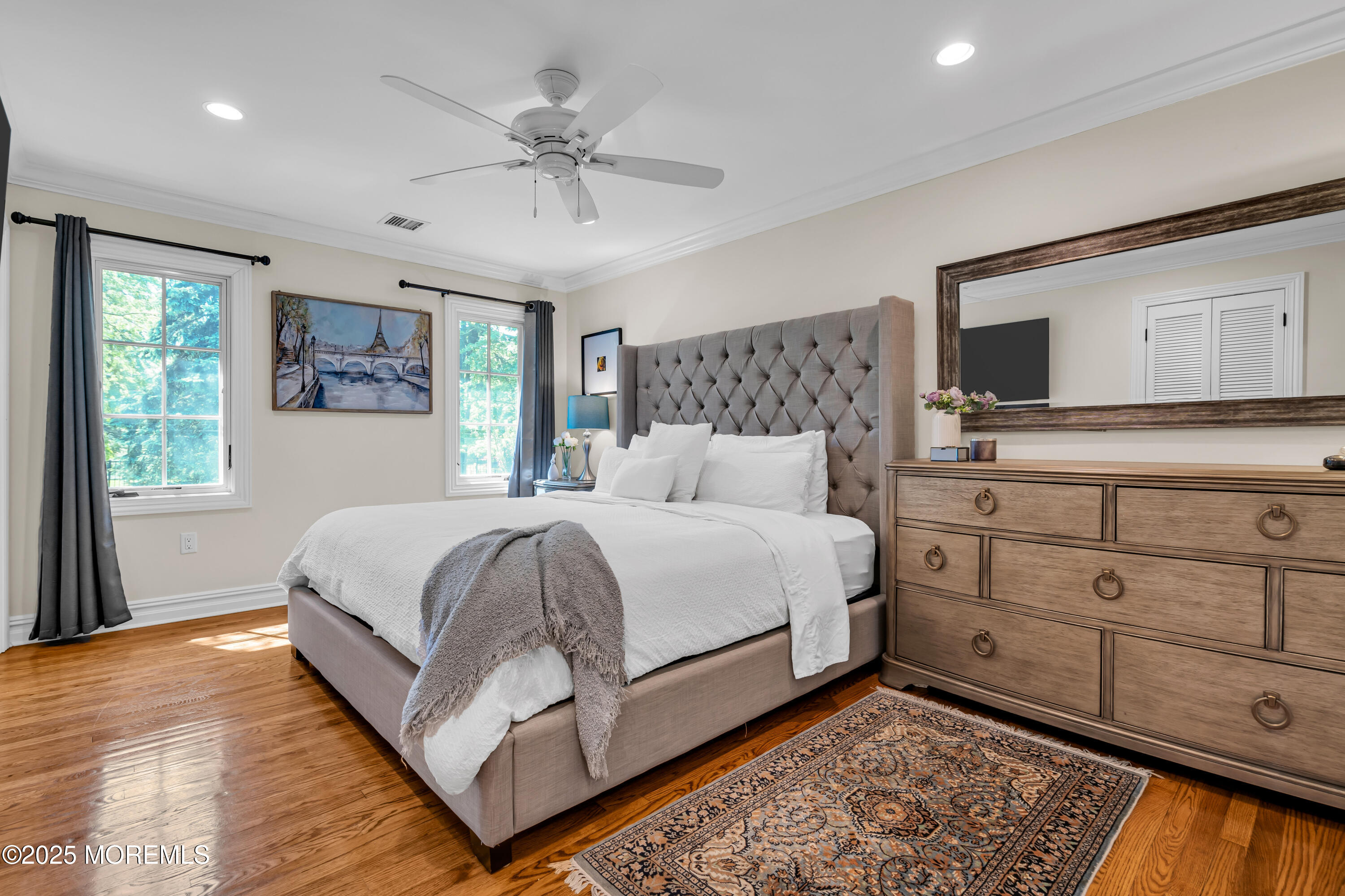 91 Ridge Road Rumson, NJ 07760 - Photo 49 of 80 a bedroom with a large bed and a tv