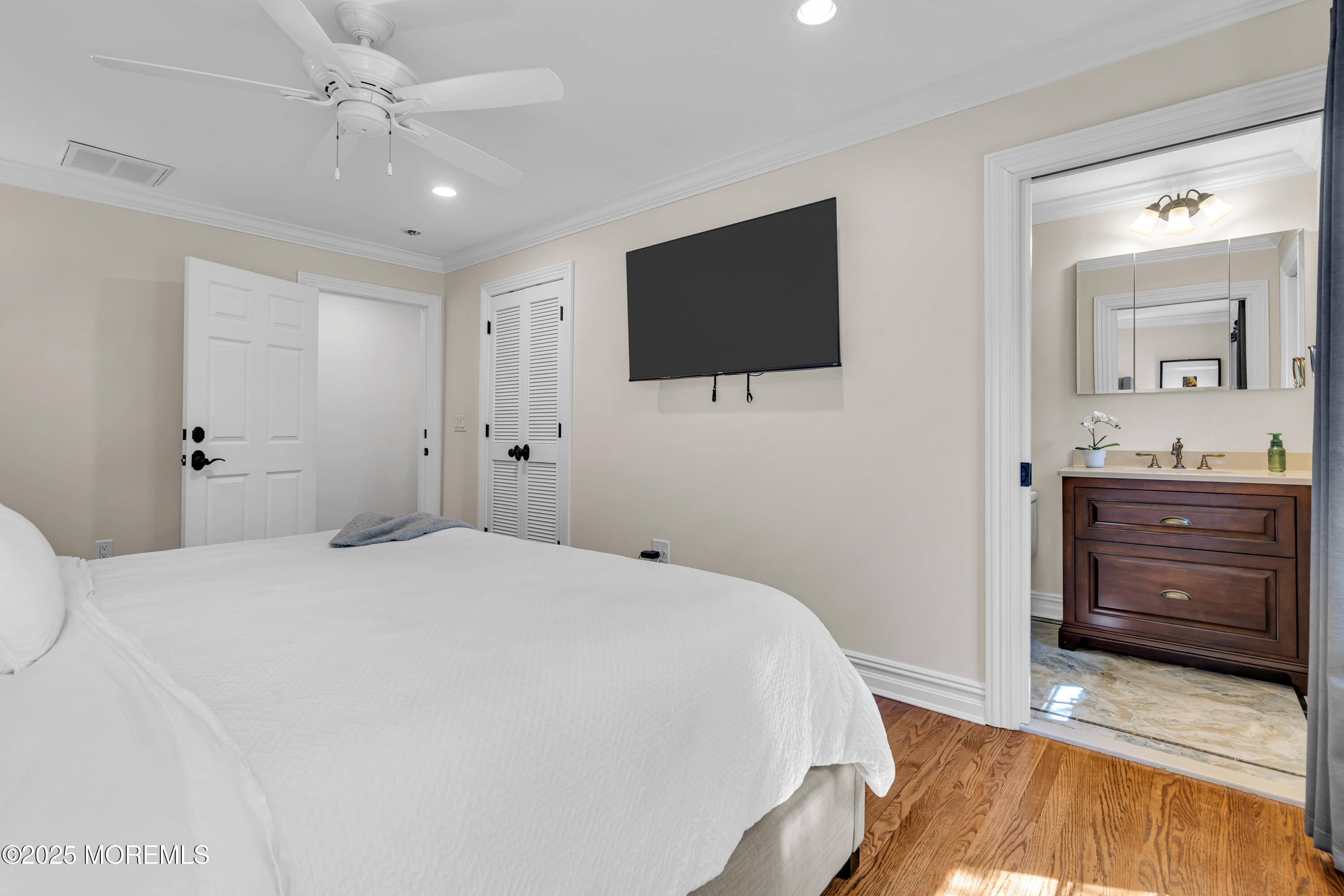91 Ridge Road Rumson, NJ 07760 - Photo 50 of 80 a bedroom with a bed and a flat screen tv