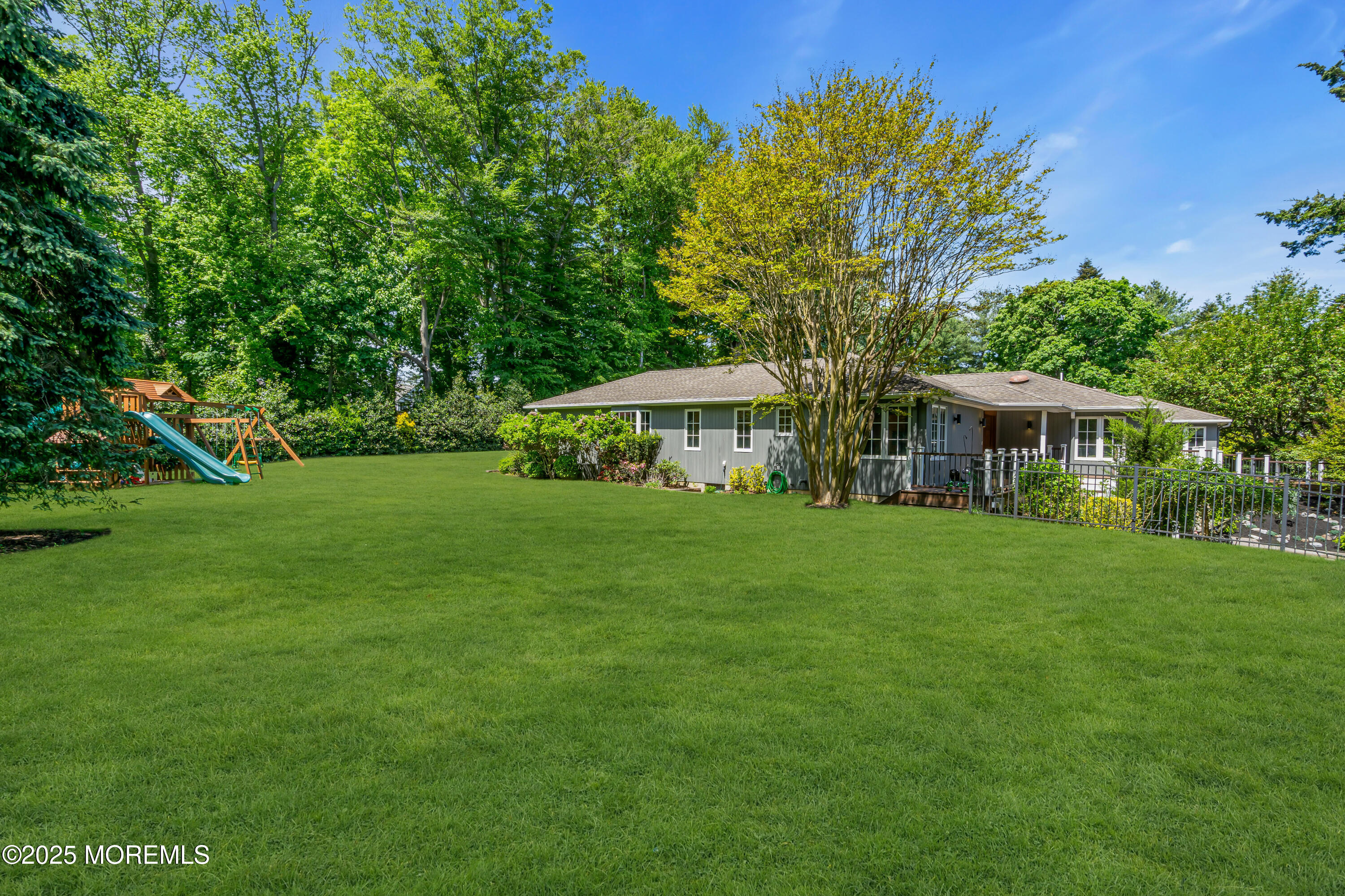 91 Ridge Road Rumson, NJ 07760 - Photo 62 of 80 a front view of a house with a garden