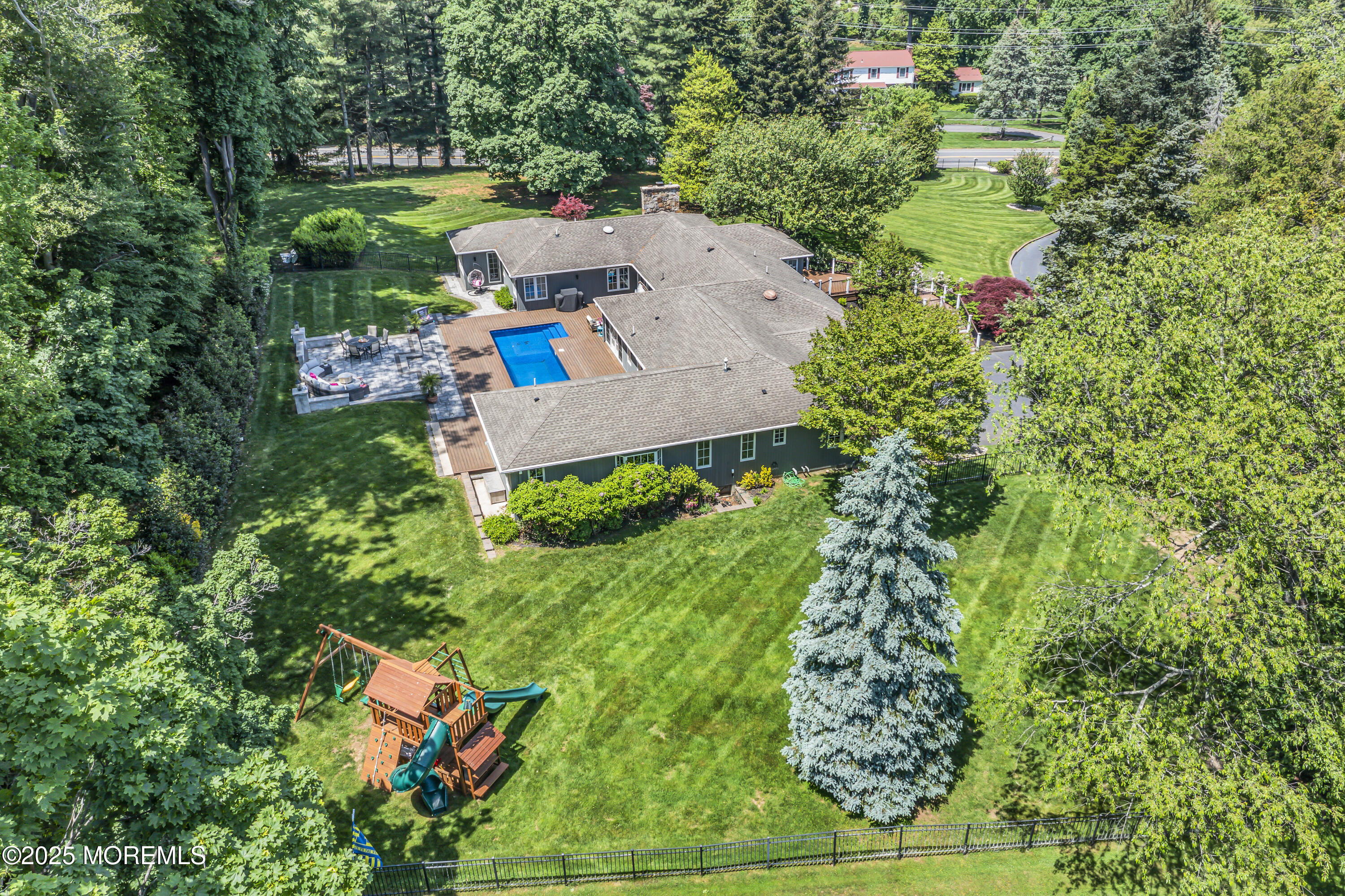91 Ridge Road Rumson, NJ 07760 - Photo 71 of 80 an aerial view of a house with a yard basket ball court and outdoor seating