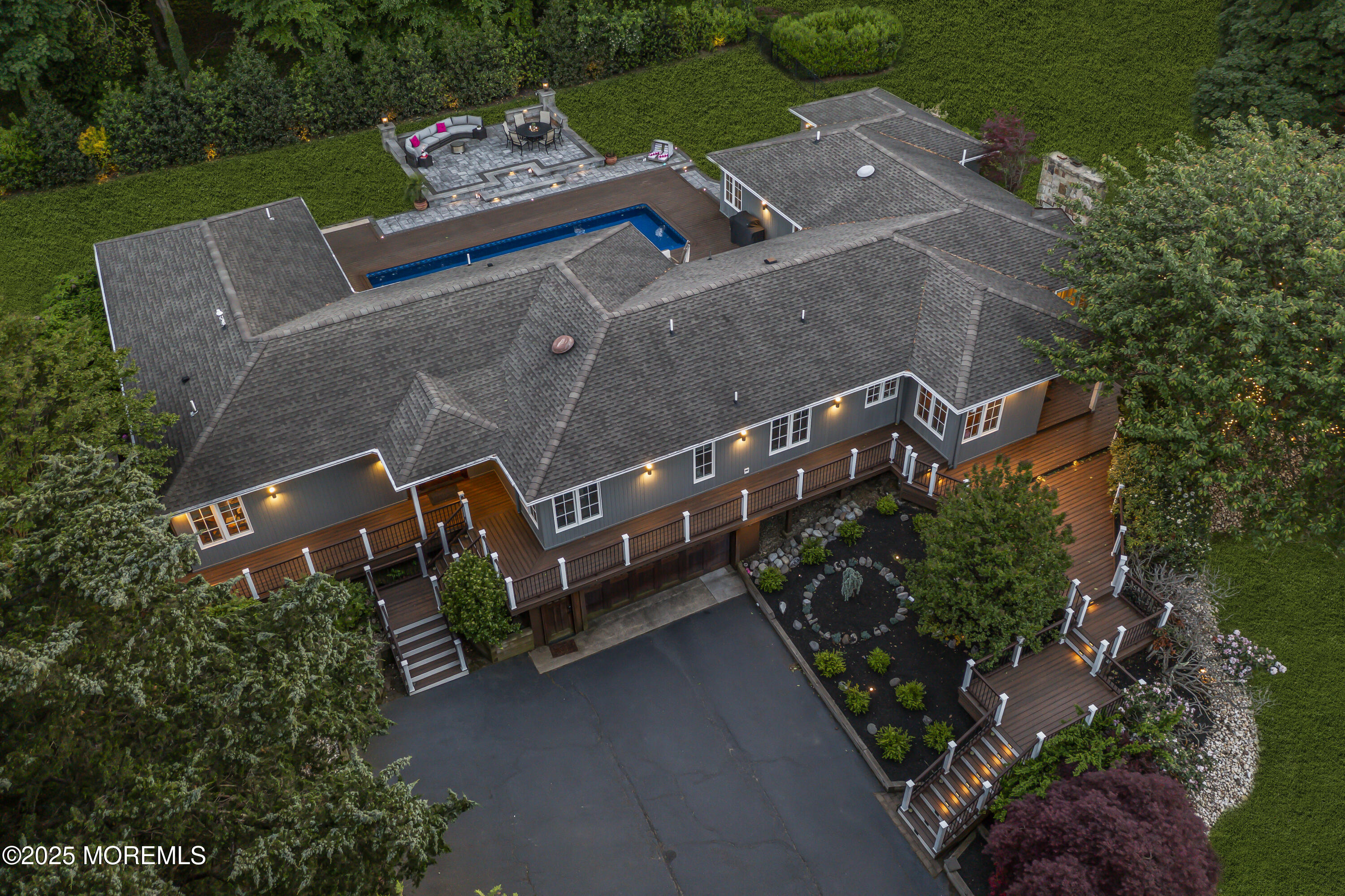 91 Ridge Road Rumson, NJ 07760 - Photo 73 of 80 an aerial view of a house with a yard garden and outdoor seating