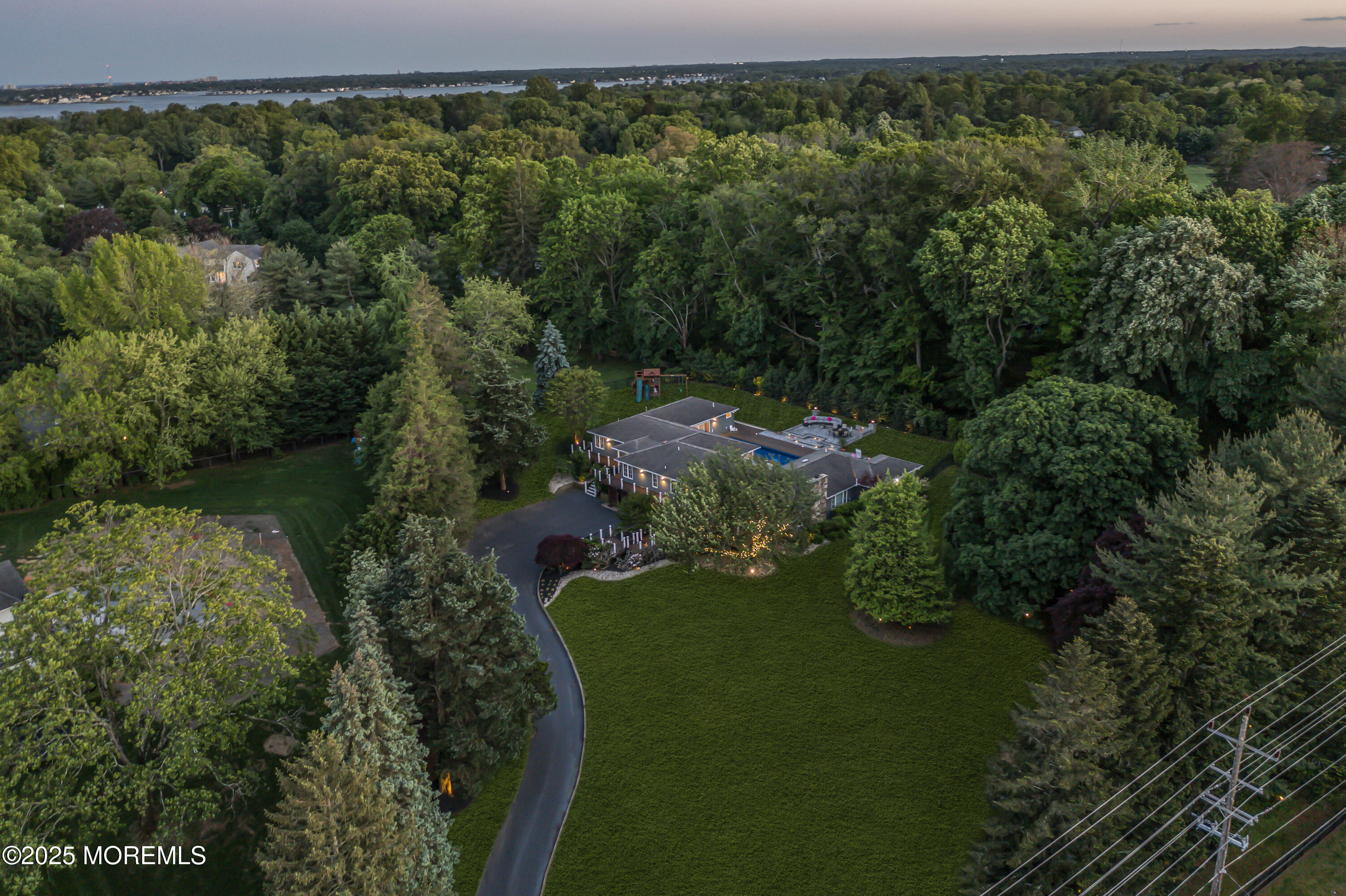 91 Ridge Road Rumson, NJ 07760 - Photo 74 of 80 an aerial view of a house with a yard basket ball court and outdoor seating
