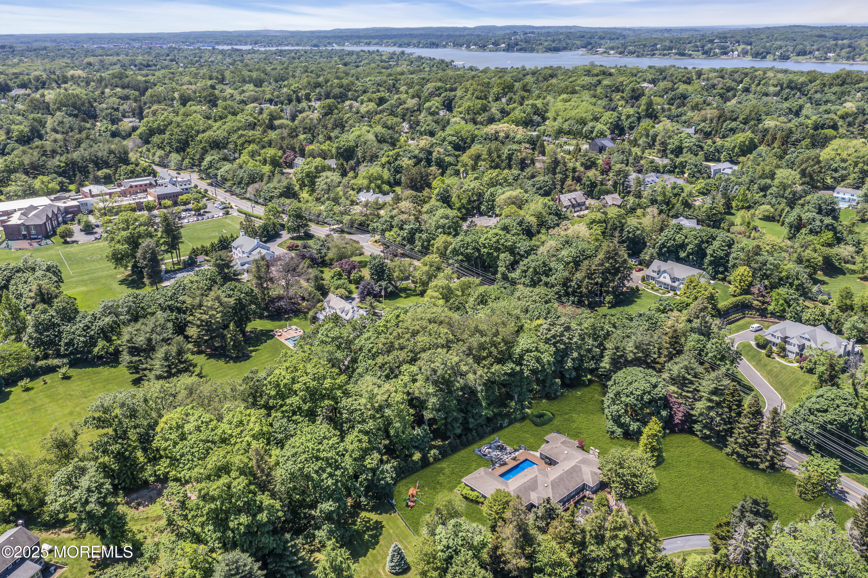 91 Ridge Road Rumson, NJ 07760 - Photo 76 of 80 an aerial view of a house with a yard