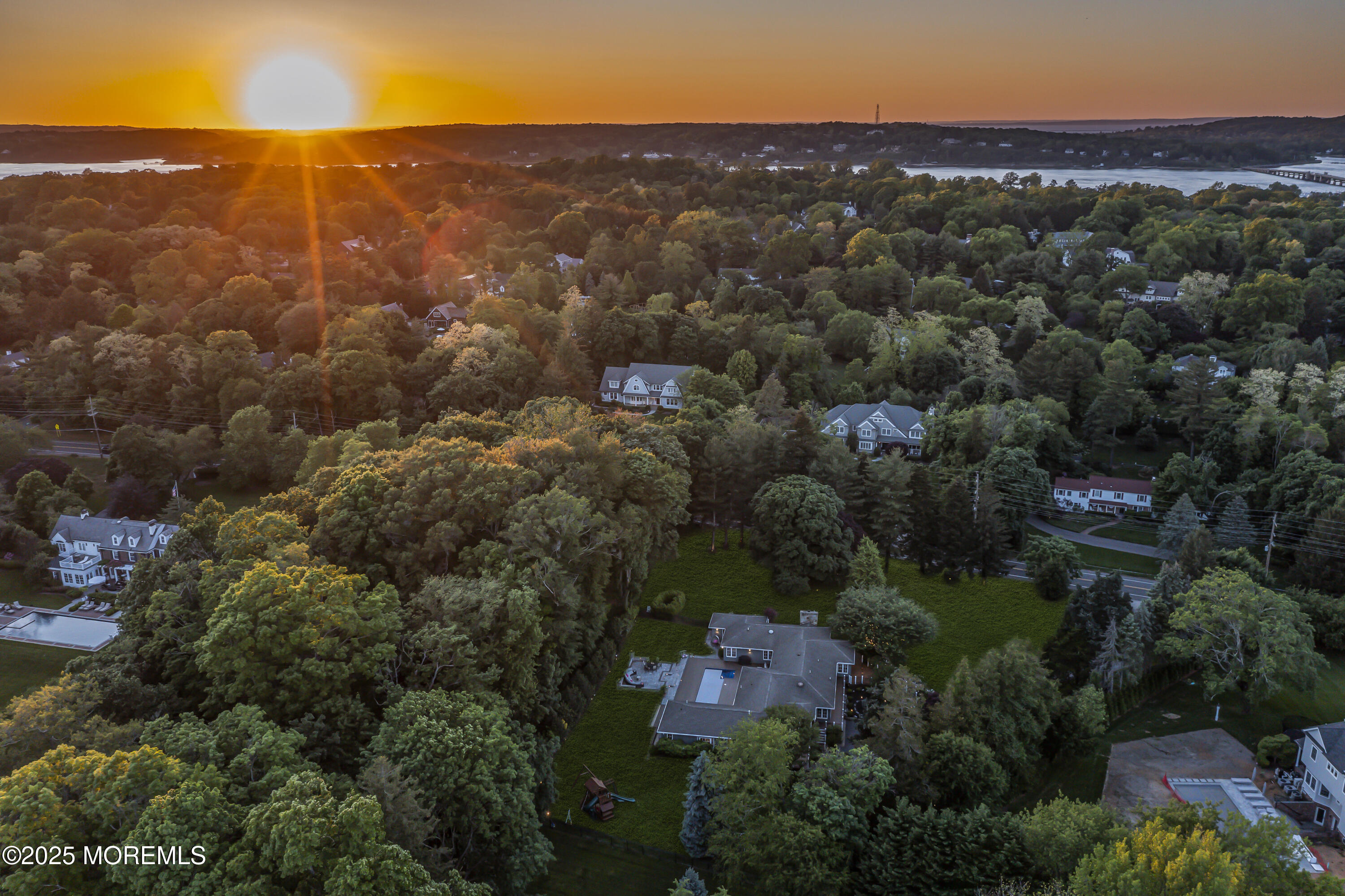 91 Ridge Road Rumson, NJ 07760 - Photo 78 of 80 an aerial view of residential houses with outdoor and green space