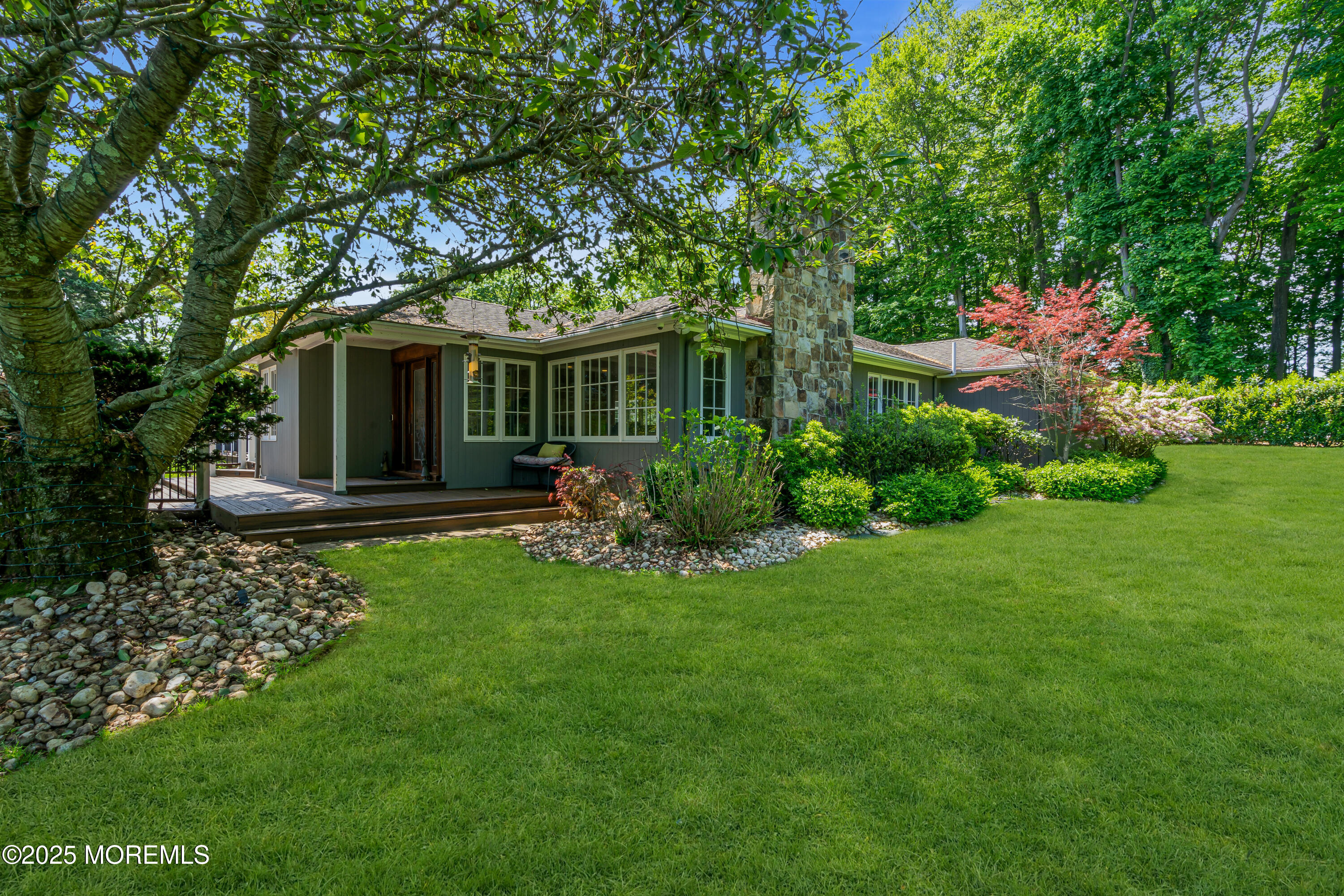 91 Ridge Road Rumson, NJ 07760 - Photo 9 of 80 a front view of house with yard and green space