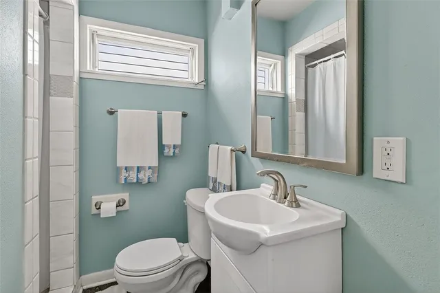 a view of house with swimming pool and outdoor kitchen