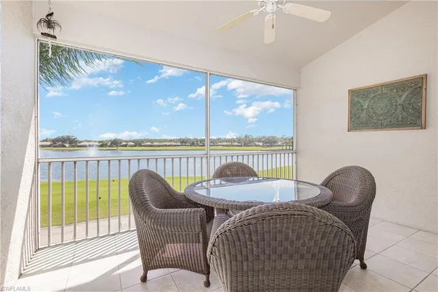 a view of a chair and table in the balcony