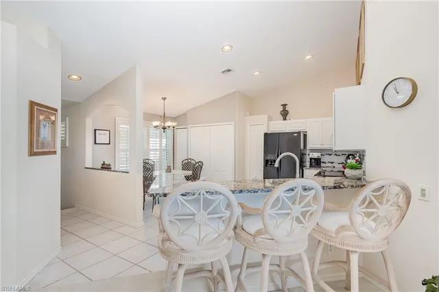 a view of a dining room with furniture and a fireplace
