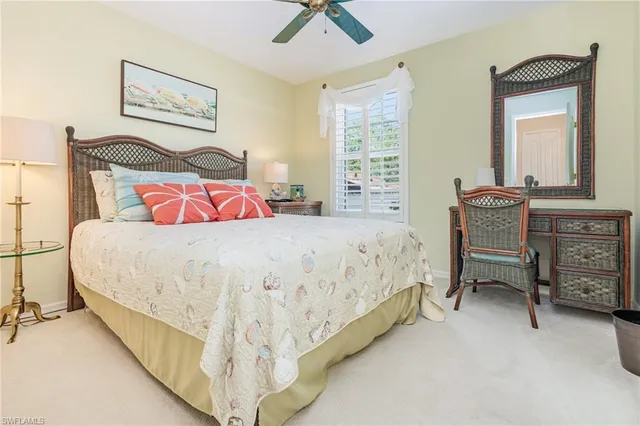 a bedroom with a bed and dresser