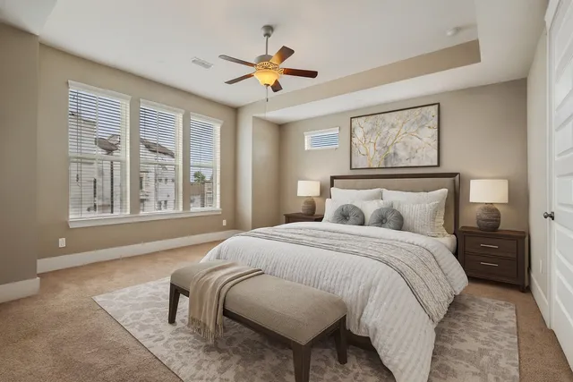 a bedroom with a large bed and a window