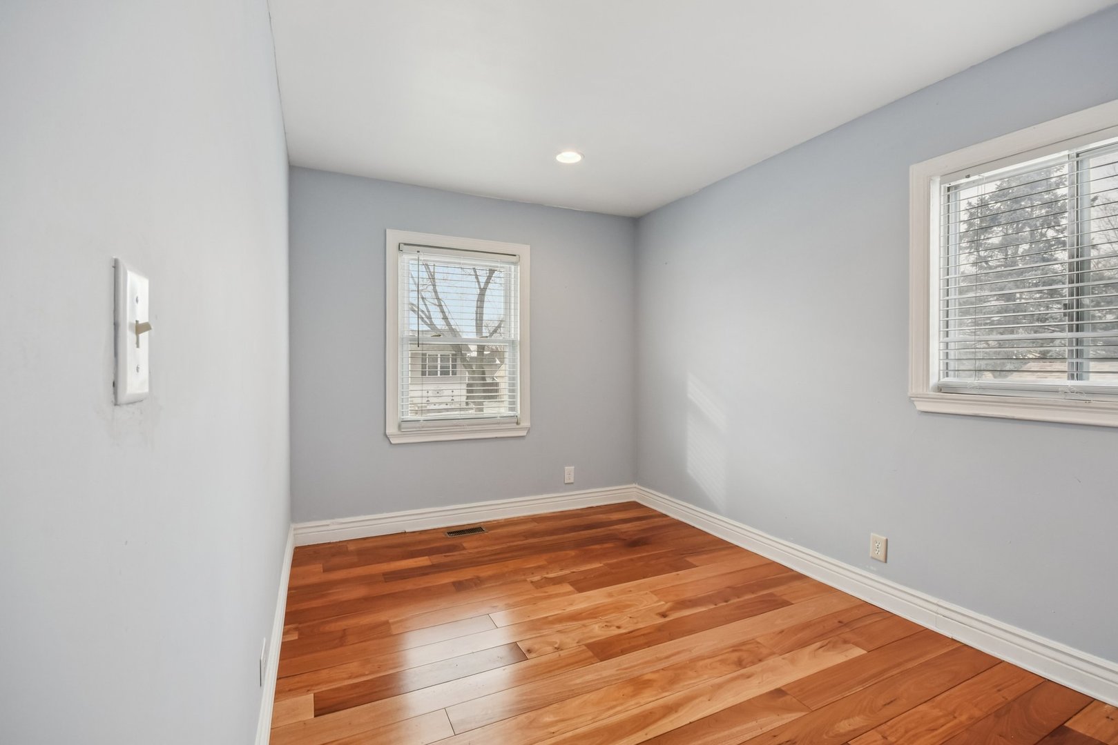 301 Villa Road Streamwood, IL 60107 - Photo 12 of 34 a view of empty room with wooden floor and fan